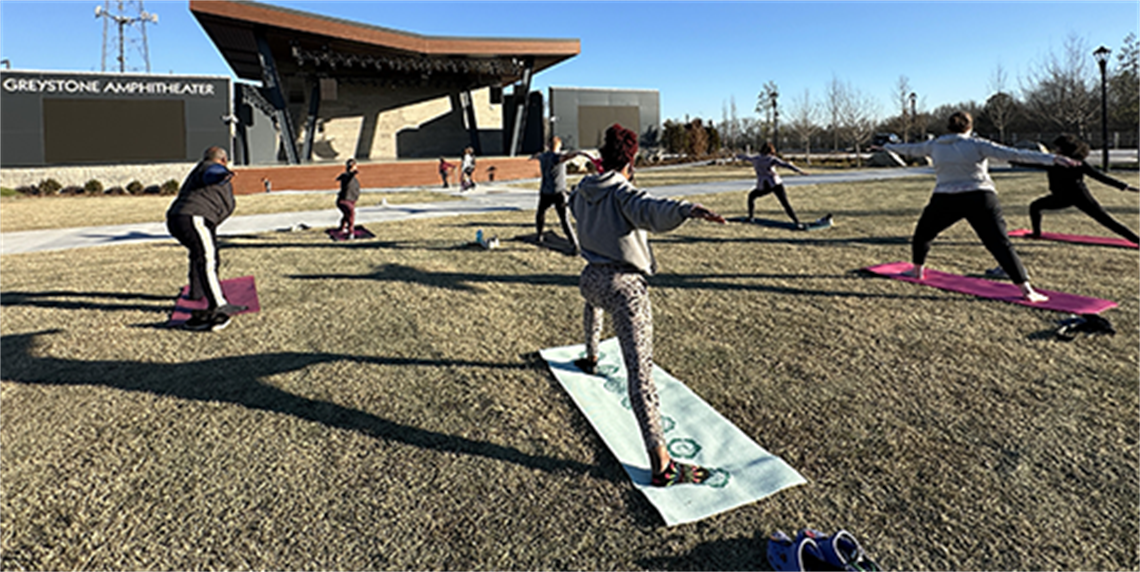 Group doing Yoga on the Town Green